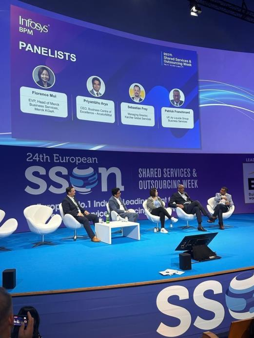 Panel discussion during the 24th European Shared Services & Outsourcing Week conference featuring industry leaders on stage.