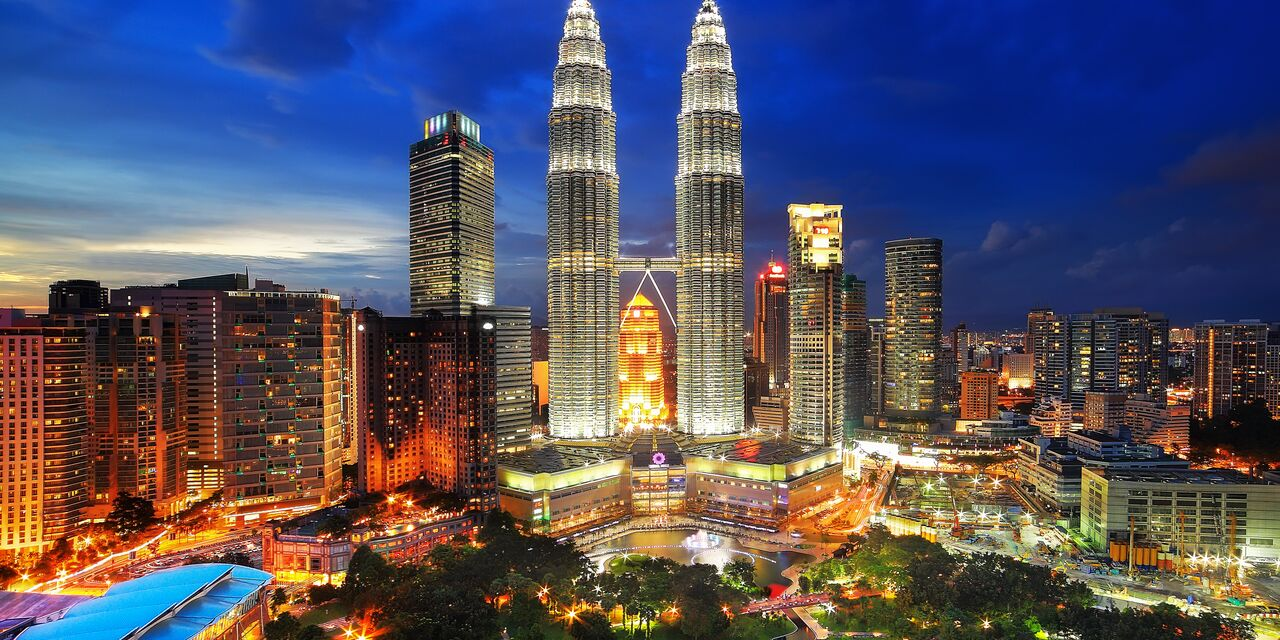 Kuala Lumpur skyline featuring the iconic Petronas Twin Towers.