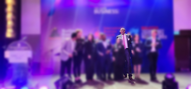 Patrick Franchinard speaking at an international business conference on leadership and business transformation.